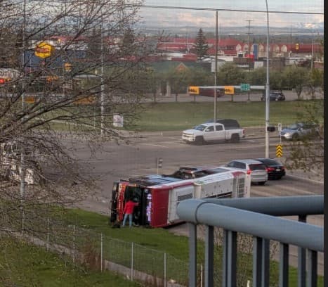 Calgary Transit Bus Knocked onto Its Side by Gravel Truck During Morning Rush Hour in SE